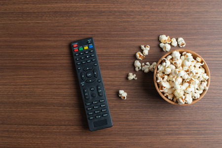 Watching a movie with popcorn.
