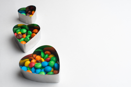 A bowl of multicolor chocolate candiesの写真素材