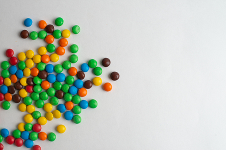Colorful chocolate candies on the white backgroundの写真素材