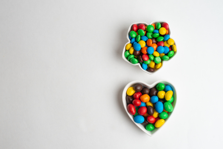 A bowl of multicolor chocolate candiesの写真素材
