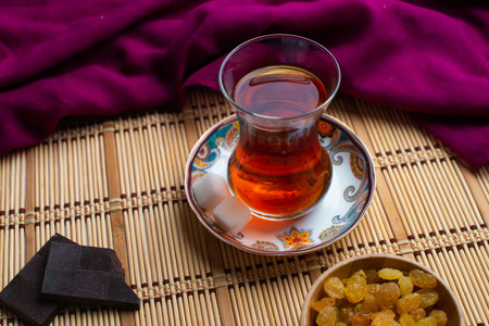 Homemade oatmeal cookies with a cup of tea on old wooden background, A cup of tea with raisin, a cup of tea with chocolateの写真素材