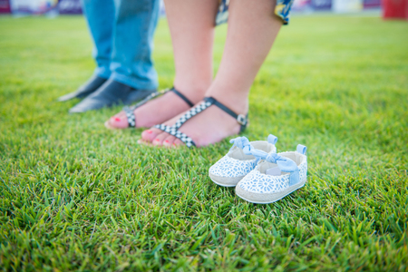 Pregnant woman, Pregnancy, Father and mother, Waiting new baby girl, new born baby, Shoes of new born babyの写真素材