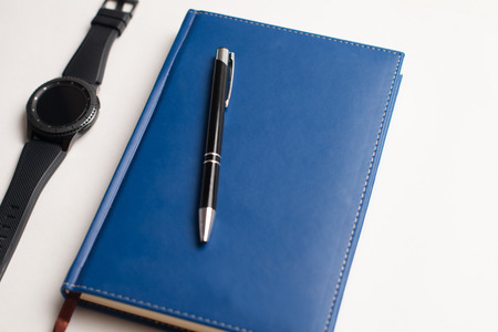 Notebook with glasses and pen, Book with glasses, Blue notebook with glasses, Book with cup of tea, working with glasses and pen, write to notebookの写真素材