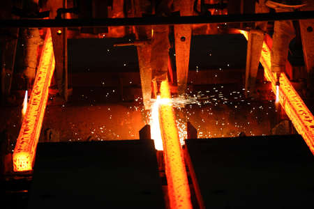 Steel billets at torch cutting in metallurgical plant. Metallurgical production, heavy industry, engineering, steelmaking.の写真素材