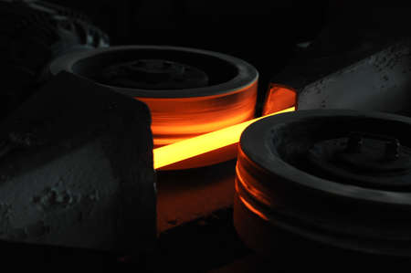 Red hot steel metal armature after molten steel casting.  Background of the blacksmith and metallurgical industry.の写真素材