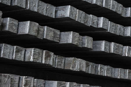 Steel billets in the warehouse of metallurgical factory. Hot ingot in a steel plant.の写真素材
