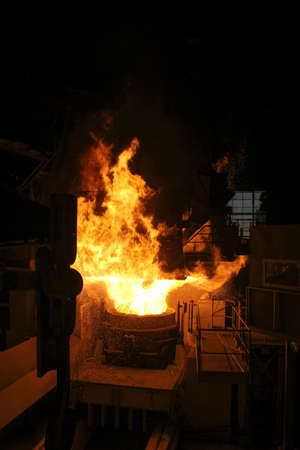 Steel production in electric furnaces. Sparks of molten steel. Electric arc furnace shop EAF....