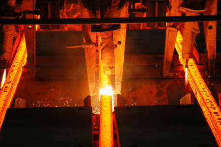 Steel billets at torch cutting in metallurgical plant. Metallurgical production, heavy industry, engineering, steelmakingの写真素材