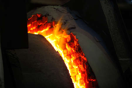 Steel production in electric furnaces. Sparks of molten steel. Electric arc furnace shop EAF....