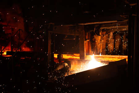 Hot red steel billets at torch cutting. Background of the blacksmith and metallurgical industry.の写真素材