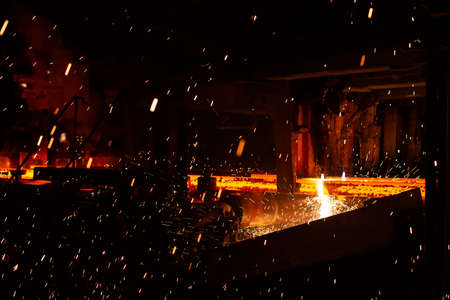 Hot red steel billets at torch cutting. Background of the blacksmith and metallurgical industry.の写真素材