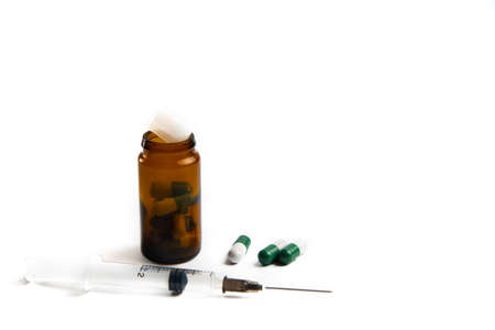 Coronavirus 2019-nCoV outbreak. Pills and syringe on a white isolated backgroundの写真素材