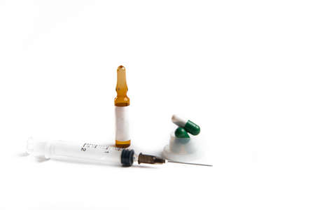 Coronavirus 2019-nCoV outbreak. Pills and syringe on a white isolated backgroundの写真素材