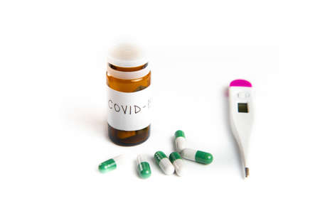 Coronavirus 2019-nCoV outbreak. Pills and thermometer on a white isolated backgroundの写真素材
