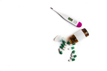 Coronavirus 2019-nCoV outbreak. Pills and thermometer on a white isolated background.