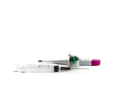 Coronavirus 2019-nCoV outbreak. Pills, thermometer and syringe on a white isolated background.の写真素材