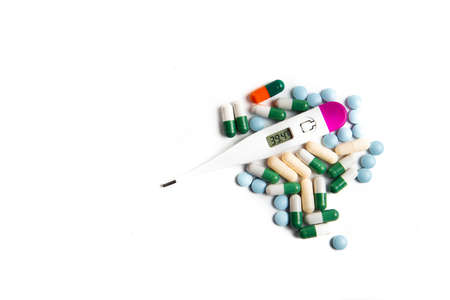 Coronavirus 2019-nCoV outbreak. Pills and drug, care during illness. Thermometer on a white isolated...