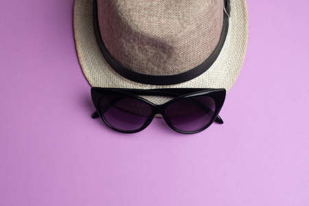 Summer accessories, hat and sun glasses on pink background. Summer and sea concept.の写真素材