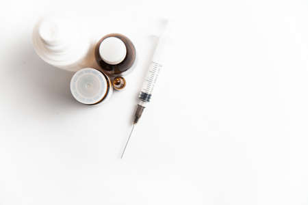 Coronavirus 2019-nCoV outbreak. Drug bottles and syringe on a white isolated backgroundの写真素材