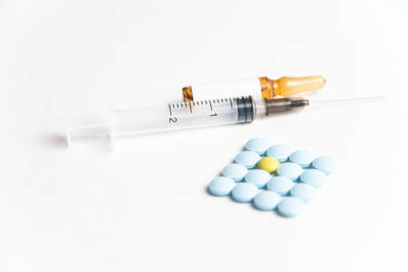 Coronavirus 2019-nCoV outbreak. Pills and syringe on a white isolated backgroundの写真素材