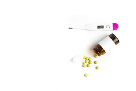 Coronavirus 2019-nCoV outbreak. Pills and drug, care during illness. Thermometer on a white isolated background.の写真素材