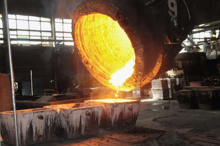 Steel production in electric furnaces. Sparks of molten steel. Electric arc furnace shop EAF....