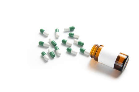 Coronavirus 2019-nCoV outbreak. Pills and drug, care during illness. Drugs with glass on white isolated background.の写真素材