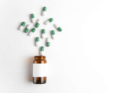 Coronavirus 2019-nCoV outbreak. Pills and drug, care during illness. Drugs with glass on white isolated background.の写真素材