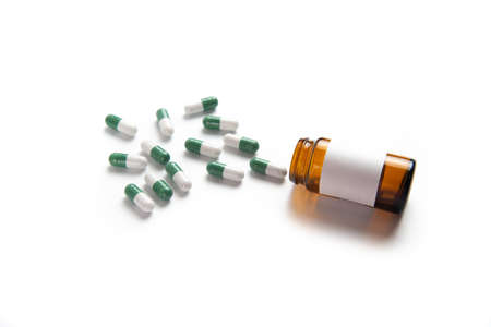 Coronavirus 2019-nCoV outbreak. Pills and drug, care during illness. Drugs with glass on white isolated background.の写真素材