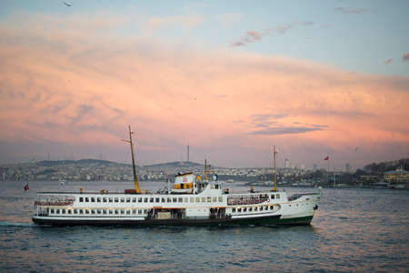 Ferry and red sunset in Istanbulの写真素材