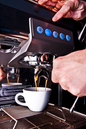 Barista making coffee with coffee machineのeditorial素材