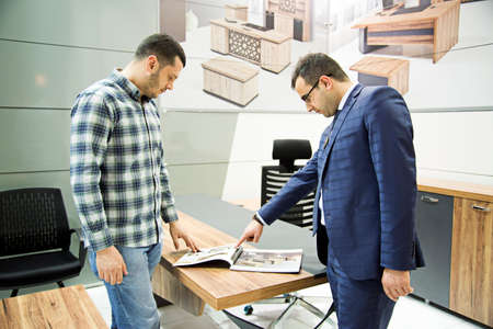 Customers and sellers negotiate sales at Istanbul Furniture Fair in istanbul, Turkey, February 8 2020のeditorial素材