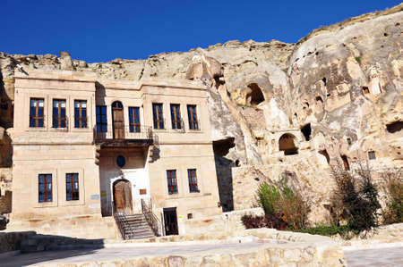 in front of the caves in the valley hand-carved stone houses, patterns on the walls and windows in urgup, cappadocia, Turkeyのeditorial素材