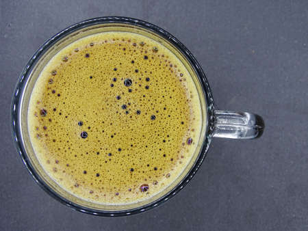 The foam of coffee in the glass cupの写真素材