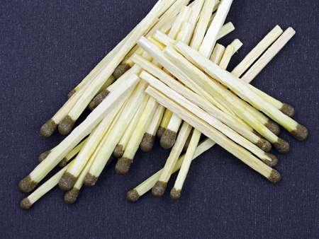Matches and matchbox on black background
