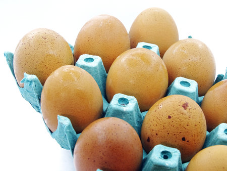 Organic brown eggs in cardboard package. Organic village eggs provide higher protein.の写真素材