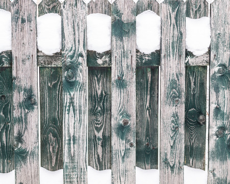 Texture of the wooden fence covered with snow. Wood patternの写真素材