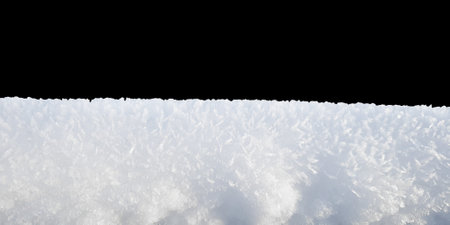 Snow isolated on black background. Large flakes and ice crystals close-up. Detailed textureの写真素材