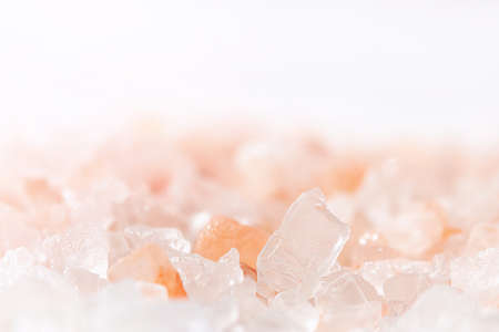 Close-up of Himalayan pink salt crystals. Selective focus. Space for textの写真素材
