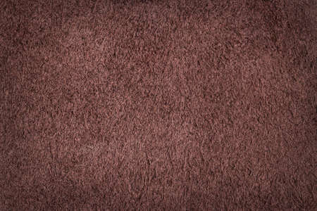 Natural texture of dark brown suede. Fluffy and soft chamois leather. Environmental material. Close up of background for design.の写真素材
