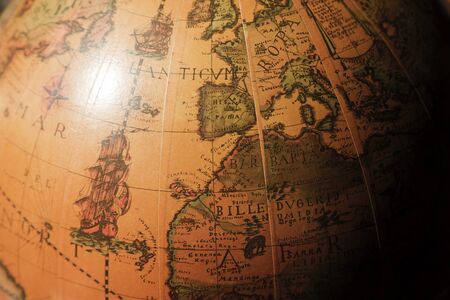 Vintage globe western Europe and northern Africa, as well as the Atlantic ocean.. High noon sunlight highlights and shadows simulate way light is cast on our planet by the sun.のeditorial素材