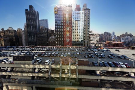 New-York, USA - November 6th, 2012: Wide angle view of the NYC Port Authority's (central bus station) rooftop parking lot, almost full with cars, and surrounded by midtown skyscrapers.のeditorial素材