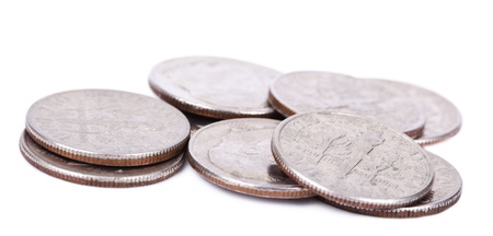 A pile of American Dimes (10 cents) isolated on white background.の写真素材