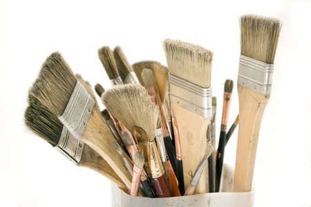 A large group of different sizes of paintbrushes isolated on white background. 