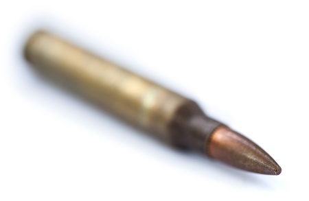 An isolated 5.56 assault rifle cartridges (for M-16 assault rifle for example).
Shot diagonally from...