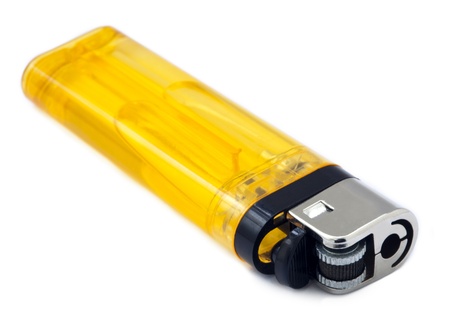 Half-transparent simple yellow lighter isolated on white background.の写真素材