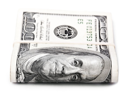 A bunch of 100 American Dollars money notes folded and held together with a simple rubber band....