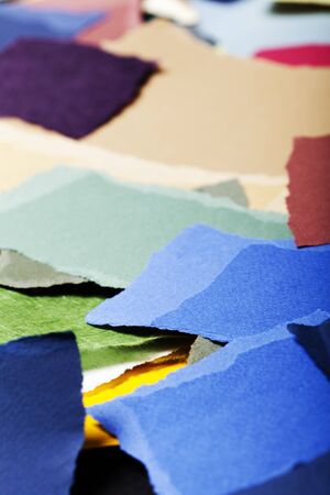 Large group of torn pieces of paper in a large variety of colors.の写真素材
