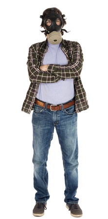 A caucasian male in his early 30's dressed in a casual attire and wearing a gas mask, looking at the camera with his arms crossed. Isolated on white background.の写真素材