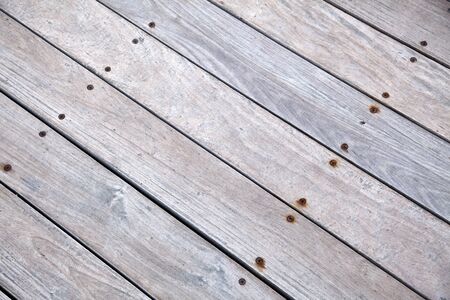 Sunlit wooden deck, depicted diagonally